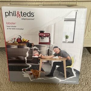 Phil and Teds Lobster Hook On High Chair New In Box, black. Never used.